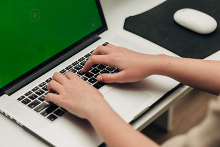 Close-Up Shot of Human Hands Placed Over Laptopの写真素材