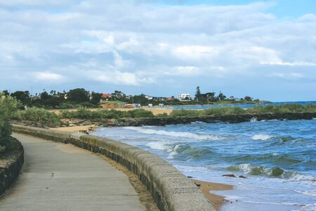 Coastline walk along Brighton beachの写真素材