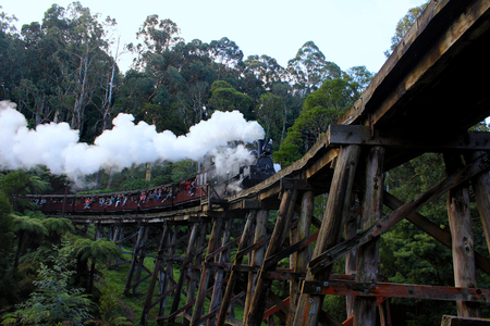 Steam train through the mountainsの写真素材