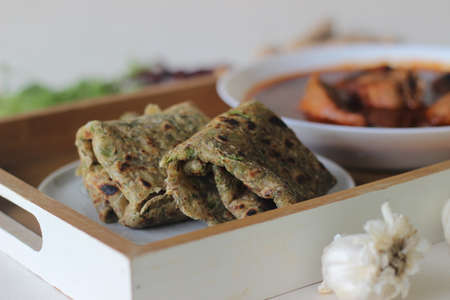 Indian flat bread made of whole wheat flour with grounded flax seed and fresh coriander leaves...