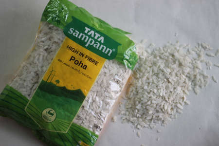 Mumbai, Maharashtra, India, March 07 2021: Flattened rice in a green packaging by Tata sampann from India. It is commonly known as Poha in Indiaのeditorial素材