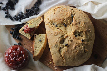 Slices of home baked Irish soda bread with raisins. A quick bread to make at home with out yeast....