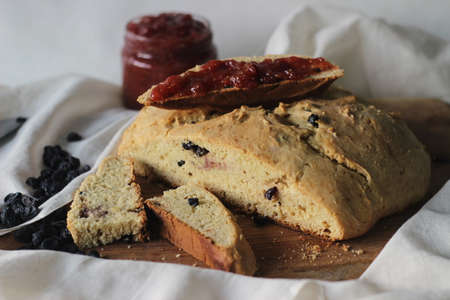 Slices of home baked Irish soda bread with raisins. A quick bread to make at home with out yeast....