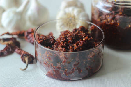 Garlic Chutney. A condiment made of garlic and red chilies. Goes well with Indian flatbread or parathas. Shot on white backgroundの写真素材