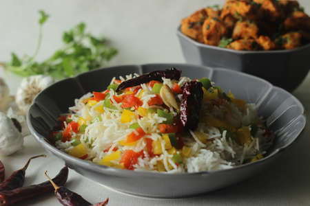 Steamed basmati rice tossed with sauteed bell peppers flavoured with red chillies and garlic. Served...