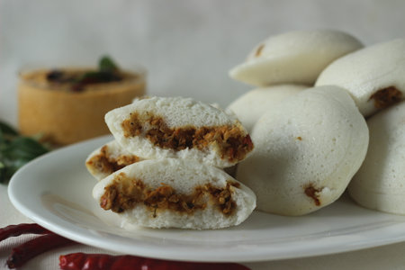 Chicken Stuffed steamed rice cake. Steamed rice cake stuffed with Chicken masala. Commonly called...