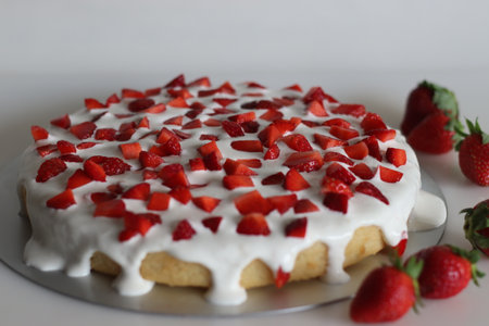 Fresh cream strawberry cake. Sponge cake with Strawberry and fresh cream as toppings. Shot on white...