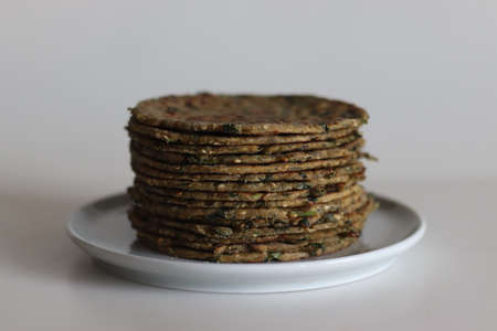 Bajra methi thepla. Indian flat bread made of pearl millet flour, fenugreek leaves, sesame seeds,...