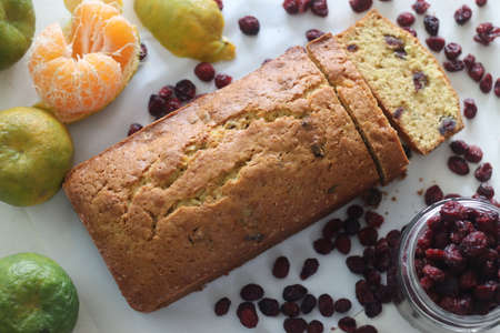 Sliced Orange cranberry bread loaf. An orange flavoured quick bread with dried cranberries. A...