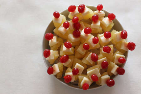 Cheese cherry pineapple. An easy to assemble, no cooking starter dish. Shot on white background