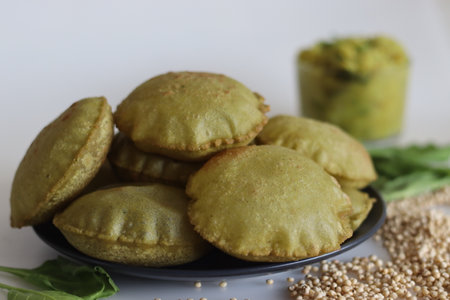 Jowar palak puri or sorghum spinach fried flat bread. Fried bread made of sorghum millet flour and...