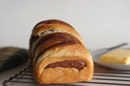 Vanilla Chocolate Swirl Bread loaf. It is a delicious, bakery style bread made with a dough of...