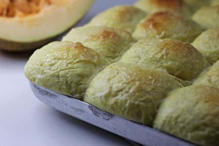Pumpkin dinner rolls. Soft and buttery dinner rolls made with pumpkin puree inside the baking tray...