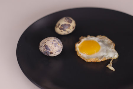 Fried Egg or Bulls Eye Eggs or Sunny Side Up Egg prepared with quail eggs. Eggs of the quail birds are a kind of eggs as food, eaten and considered a delicacy in many parts of the world.の写真素材