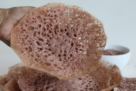 Laced navara rice Crepes or Navara rice appam. Fermented rice pancakes made with navara rice batter...