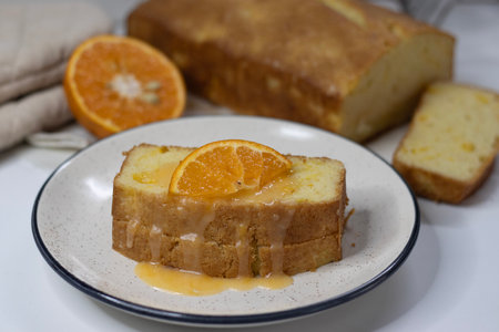 Slices of Orange pound cake, also known as citrus loaf cake or orange butter cake. Moist, flavorful...