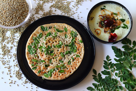 Bajra dosa, also known as millet pancake, made with nutritious muringa or drumstick leaves