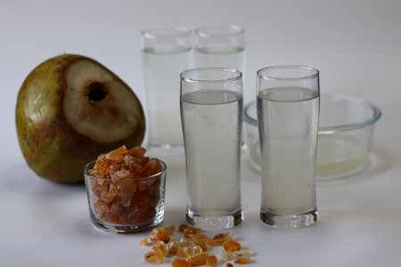 Gond Katira drink with tender coconut water served chilled in glasses, showcasing jelly like soaked...