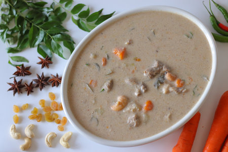 Kerala style mutton stew in a white bowl, made with tender mutton, carrots, coconut milk, curry leaves, and spices. A comforting South Indian dish perfect for festive, traditional, and culinary themesの写真素材