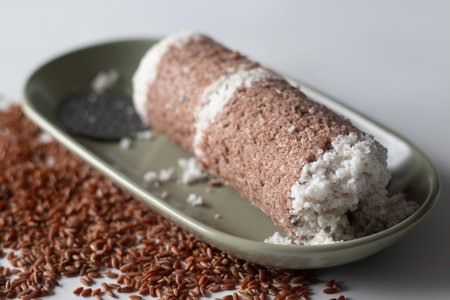Navara rice puttu or steamed rice cake, made with grated coconut and Navara rice grainsの写真素材