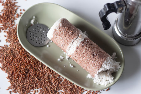 Navara rice puttu or steamed rice cake, made with grated coconut and Navara rice grainsの写真素材