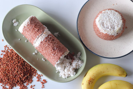 Navara rice puttu, cylindrical and dome shaped steamed rice cake with Navara rice grainsの写真素材