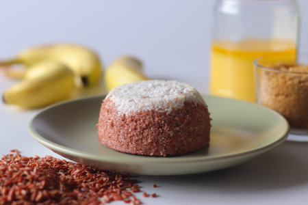 Navara rice puttu, steamed rice cake made with navara rice grains and grated coconutの写真素材