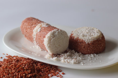 Navara rice puttu, a traditional South Indian steamed rice cake made with navara rice grainsの写真素材