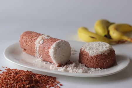 Navara rice puttu, cylindrical and dome shaped steamed rice cake with Navara rice grainsの写真素材