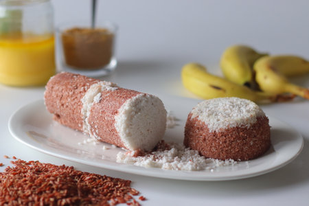 Navara rice puttu, steamed rice cake made with navara rice grains and grated coconutの写真素材