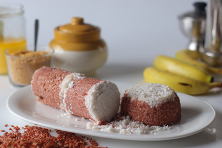 Navara rice puttu, steamed rice cake made with navara rice grains and grated coconutの写真素材