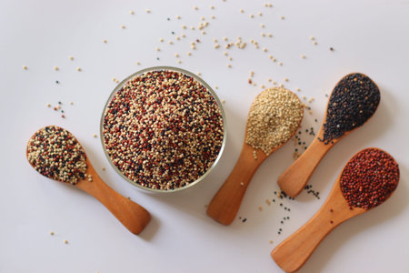 Tricolor quinoa made by mixing white, red and black quinoa seeds. Nutritious gluten free whole grains rich in plant protein and fiber. Healthy superfood for clean eating and balanced dietの写真素材