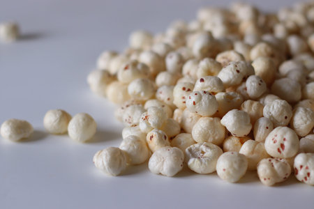Makhana also known as fox nuts or water lily seeds. Roasted healthy gluten free snack rich in...