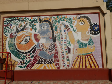 Mumbai, India, April 2022. Traditional Indian folk style mural depicting human figures and motifs on a wall inside Gurukul campus in Ghatkopar, reflecting cultural art in an educational settingのeditorial素材