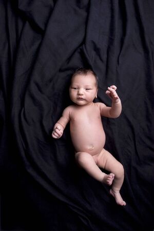 newborn baby girl is looking like a dolly