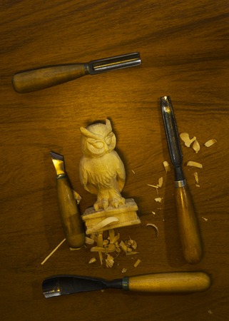 tool for carving on a table, chips and figure of wood