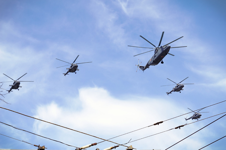 Military helicopters of Russia in the cloudy sky