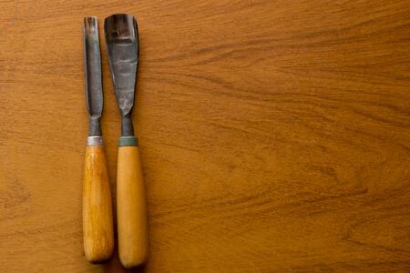 Set of Chisels on wooden backgroundの写真素材