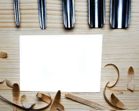 Tool for woodcarving on the table with chipsの写真素材