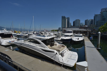 boat docked alonside marinaの写真素材