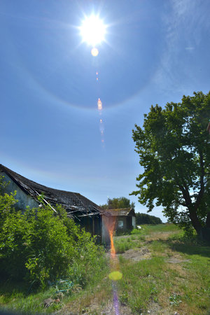 old shack with sun dog - lens flareの写真素材