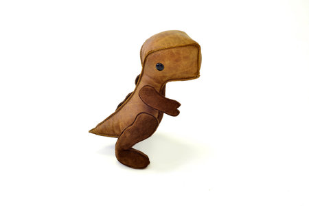 a cute custom handcrafted stuffed leather toy baby dinosaurの写真素材