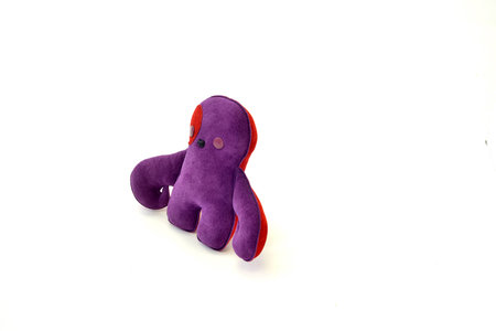 a cute custom handcrafted stuffed leather toy purple creatureの写真素材
