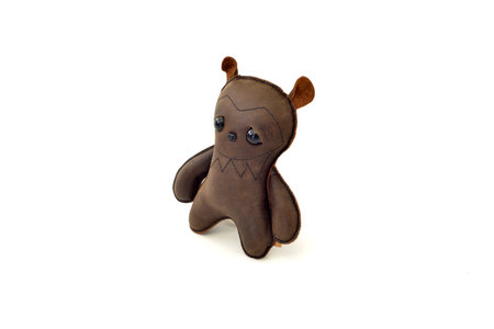 a cute custom handcrafted stuffed leather toy bearの写真素材