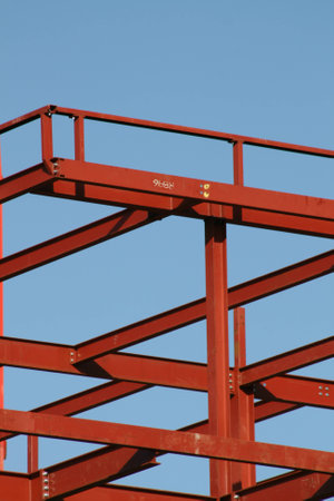 Red steel girders, building construction site, Chelmsford, Essex, Englandの写真素材