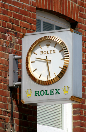 Rolex clock sign above jewellers, High Street, Chelmsford, Essex, England