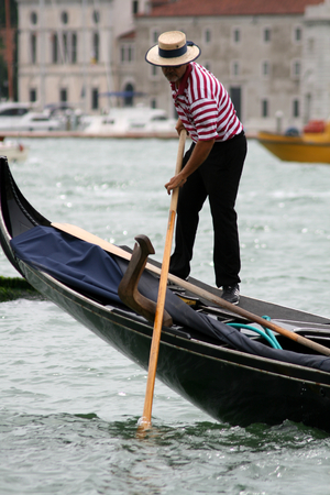 Gondolier and gondola in San Marco Basin, Venice, Italyのeditorial素材