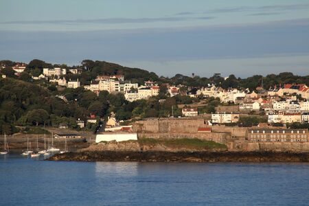 Castle Cornet and the town of St Perter Port on Guernsey in the Channel Islandsのeditorial素材