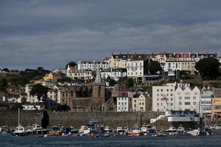 Town and harbour of St Peter Port on Guernsey in the Channel Islandsのeditorial素材