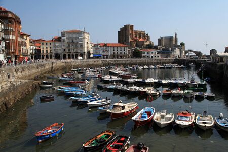 Santa Maria de la Asuncion Church dominates the skyline at the Port of Castro Urdiales, Spainのeditorial素材